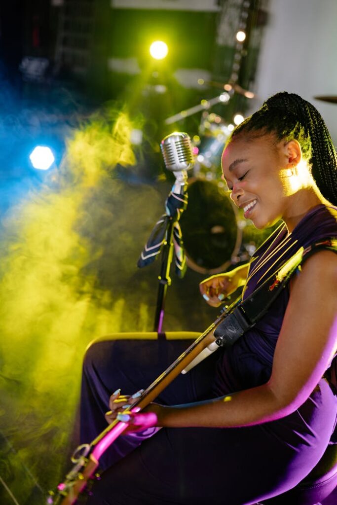 Photo of a Woman in a Dress Performing at a Concert